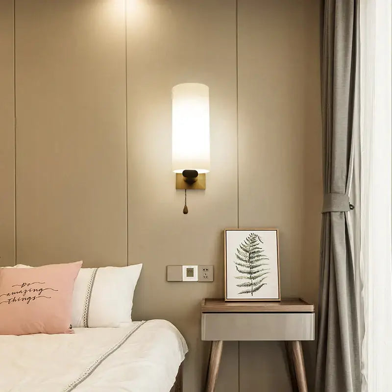 A modern minimalist led wooden wall lamp with white fabric shade brass base and pull chain switch for bedroom decorbites led wooden