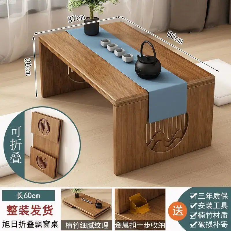 Minimalist light brown bamboo folding table with carved wave design and blue runner for bedroom tea use