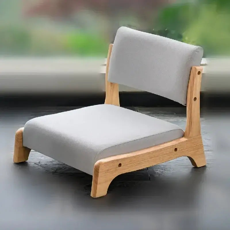 Minimalist wooden legless tatami chair with light gray upholstered seat and backrest for living room meditation