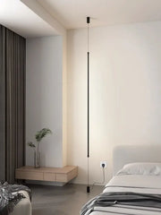 Minimalist matte black bedside pendant light with straight strip design and slender cylindrical shape for bedroom use