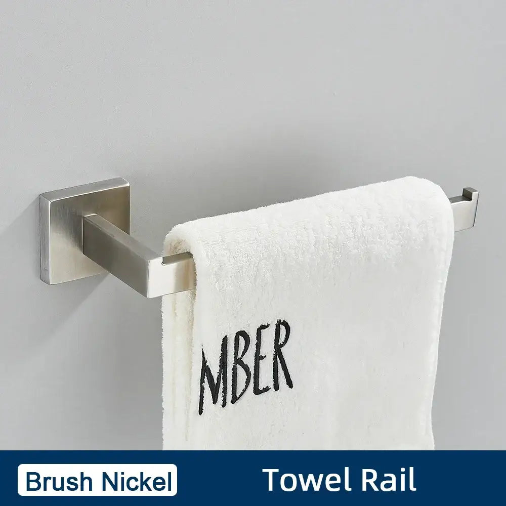 Brush nickel towel rail with white embroidered towel in a minimalist matte black stainless steel bathroom accessories set
