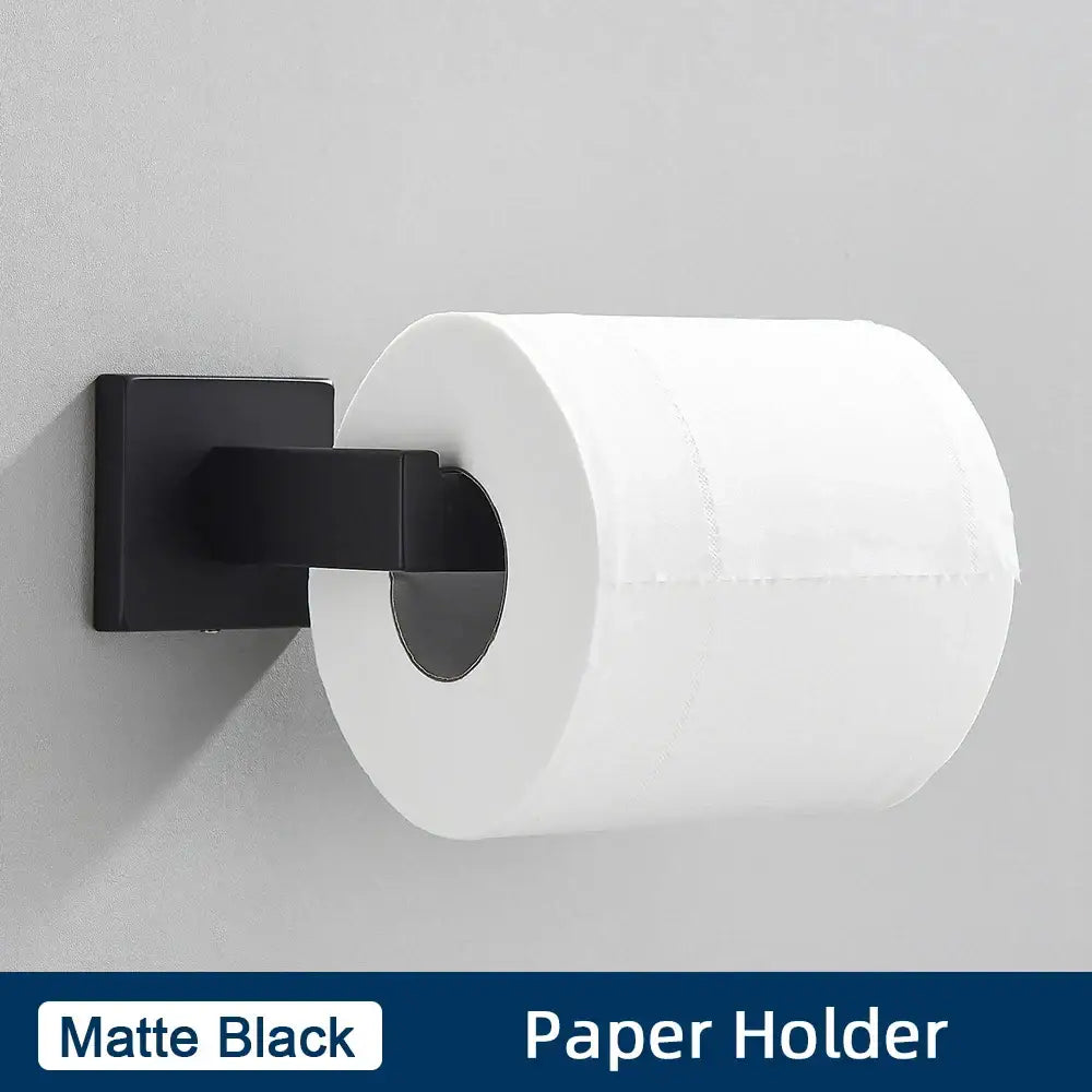 Matte black stainless steel wall-mounted paper holder from minimalist bathroom accessories set holding white toilet paper roll