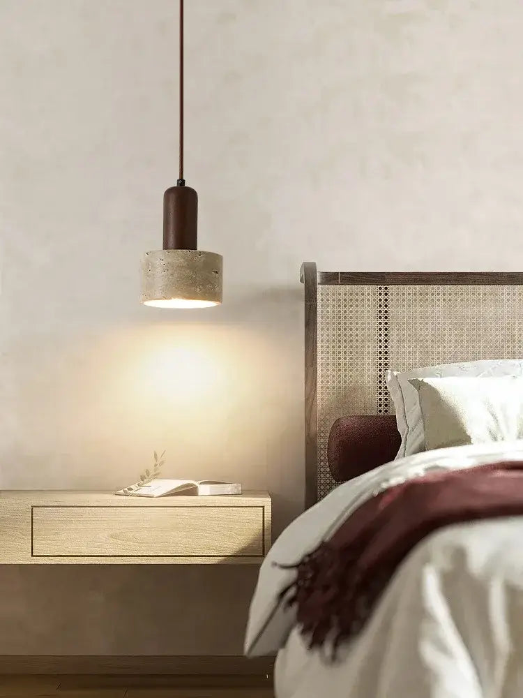 A minimalist pendant lamp with matte brown cylindrical top and textured concrete shade for dining room decorbites cream wind led