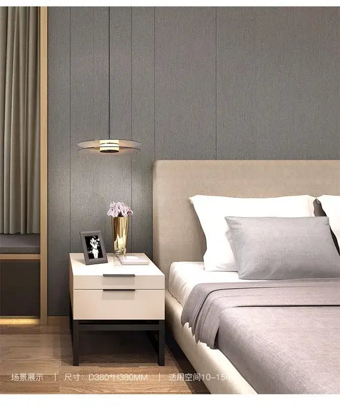 Modern minimalist white nightstand with matte finish and sleek black legs paired with glass pendant lights for dining room