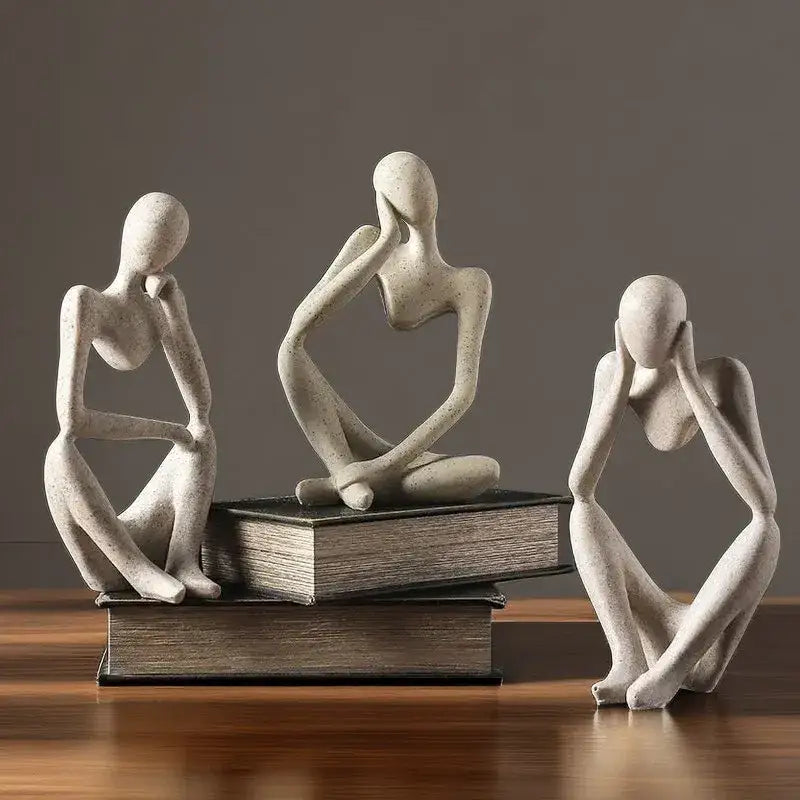 Minimalist matte white abstract thinker woman figurine with speckles displayed on stacked books for living room decor