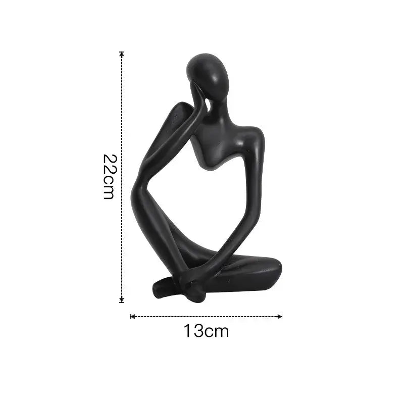 Black glossy resin abstract thinker woman figurine seated with hand on chin minimalist living room decor