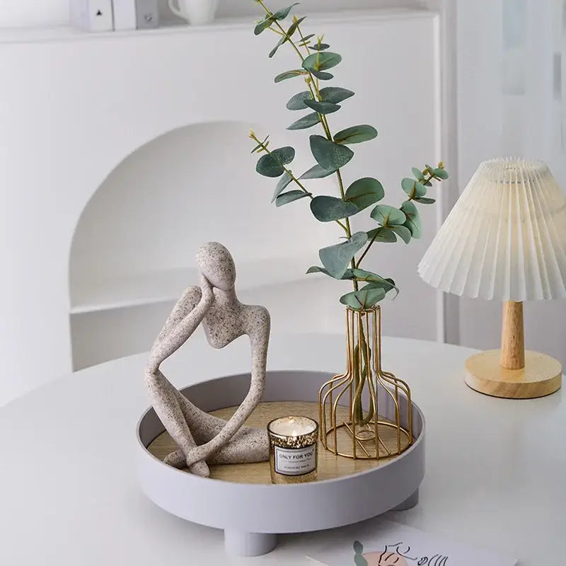 Beige speckled ceramic abstract thinker woman figurine in a minimalist matte white finish for living room decor