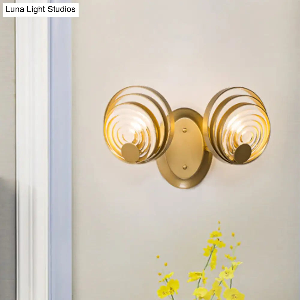 DecorBites™ DecorBites™ Minimalist Metallic Gold Swirling Wall Sconce - Elegant 1/2-Light Round Lighting Idea