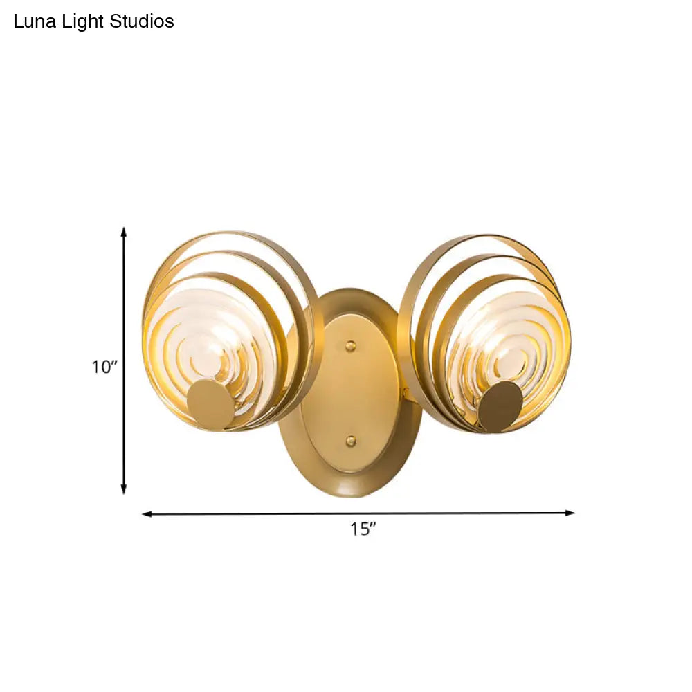 DecorBites™ DecorBites™ Minimalist Metallic Gold Swirling Wall Sconce - Elegant 1/2-Light Round Lighting Idea