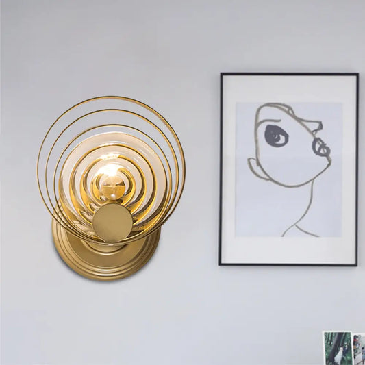 DecorBites™ DecorBites™ Minimalist Metallic Gold Swirling Wall Sconce - Elegant 1/2-Light Round Lighting Idea