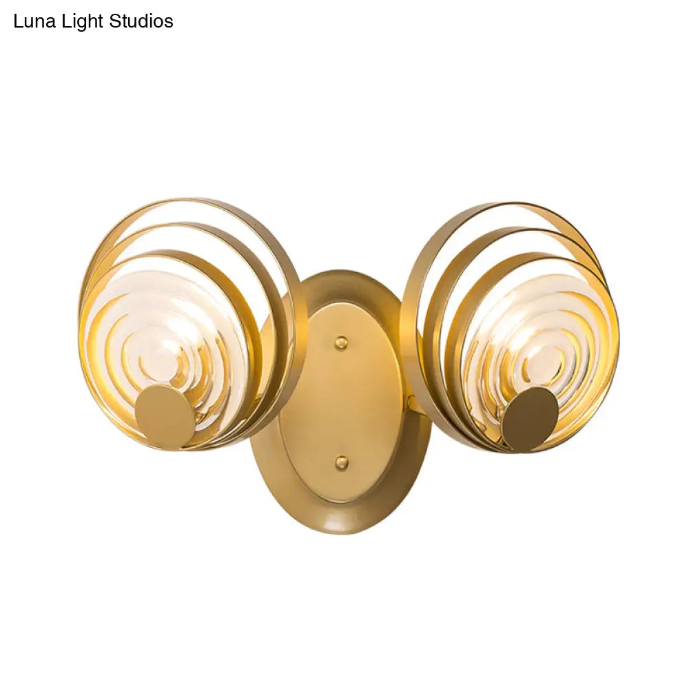 DecorBites™ DecorBites™ Minimalist Metallic Gold Swirling Wall Sconce - Elegant 1/2-Light Round Lighting Idea