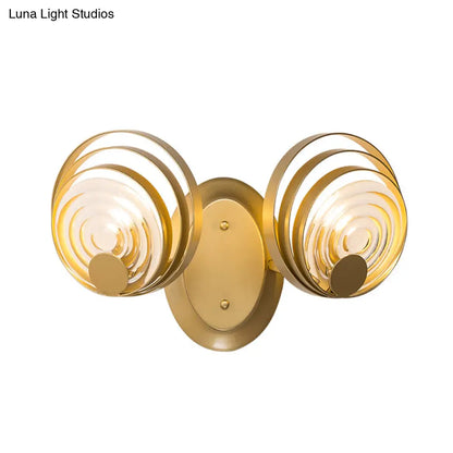 DecorBites™ DecorBites™ Minimalist Metallic Gold Swirling Wall Sconce - Elegant 1/2-Light Round Lighting Idea