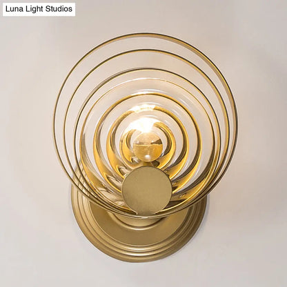 DecorBites™ DecorBites™ Minimalist Metallic Gold Swirling Wall Sconce - Elegant 1/2-Light Round Lighting Idea