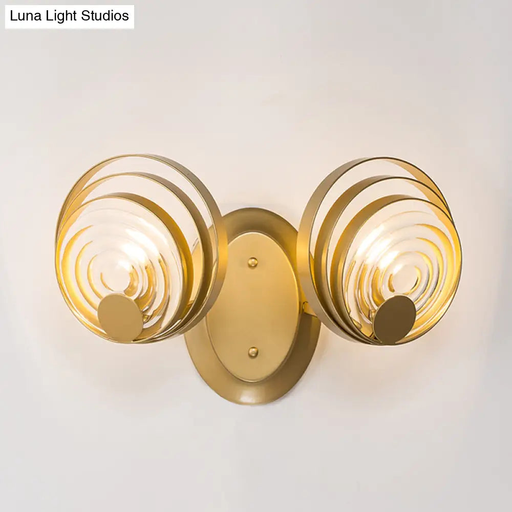 DecorBites™ DecorBites™ Minimalist Metallic Gold Swirling Wall Sconce - Elegant 1/2-Light Round Lighting Idea