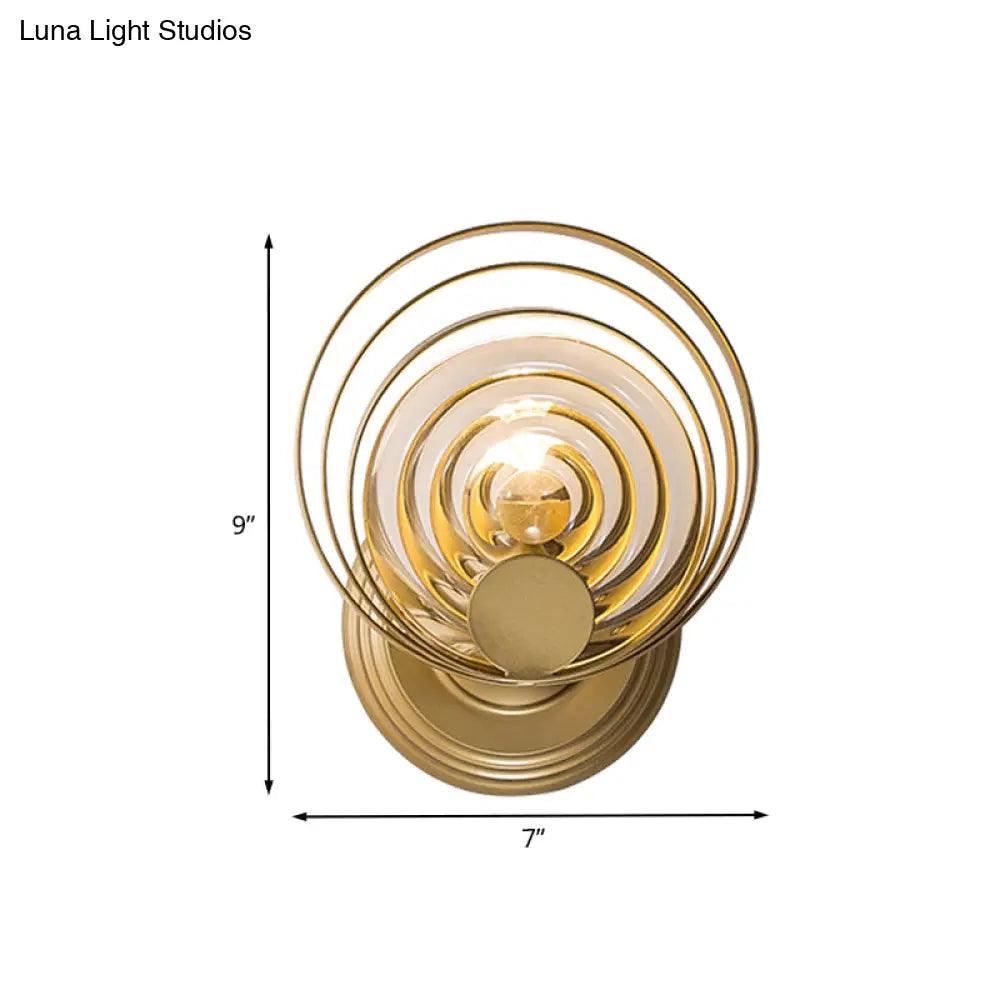 DecorBites™ DecorBites™ Minimalist Metallic Gold Swirling Wall Sconce - Elegant 1/2-Light Round Lighting Idea