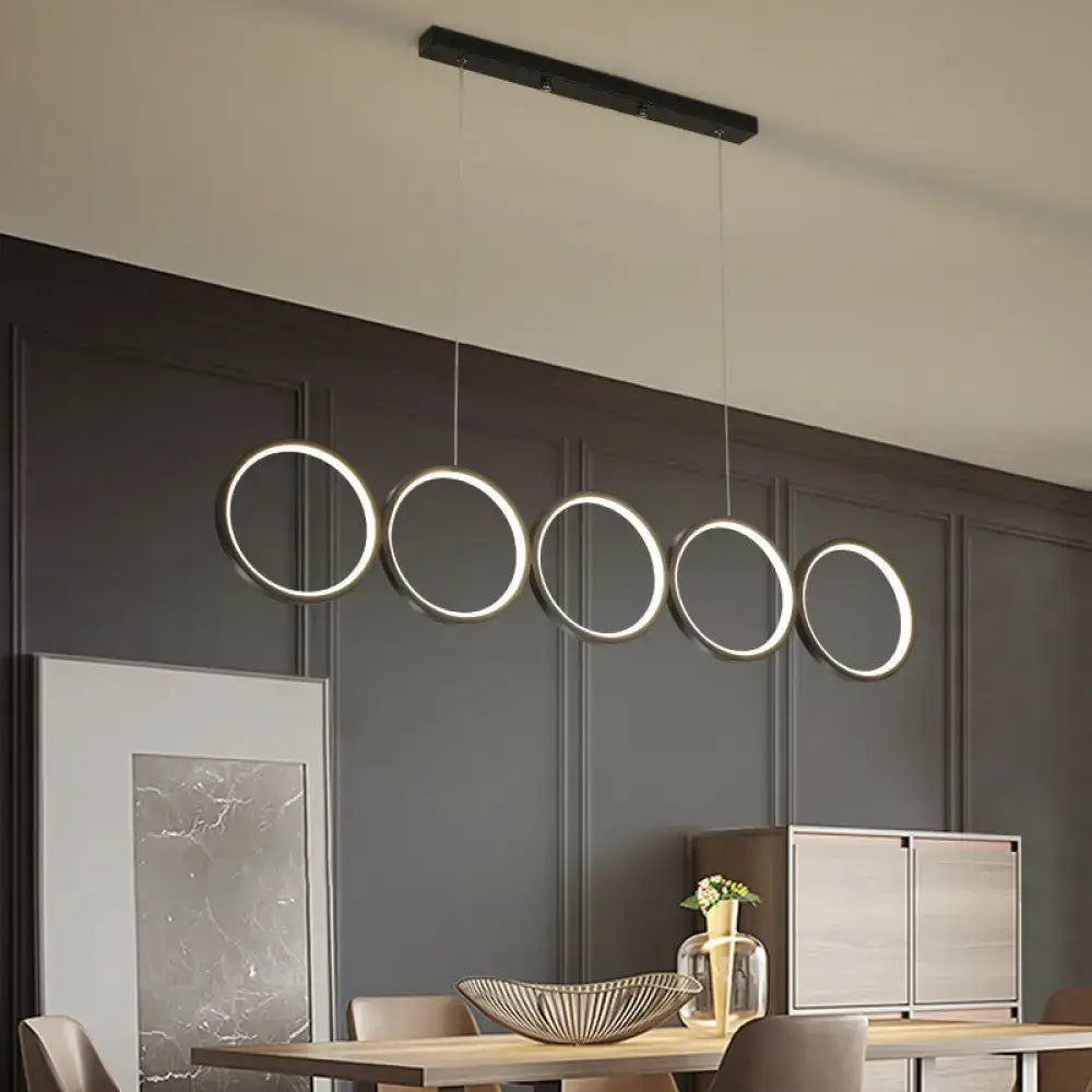 Modern black minimalist metallic led suspension lamp with five warm white light circular fixtures hanging below