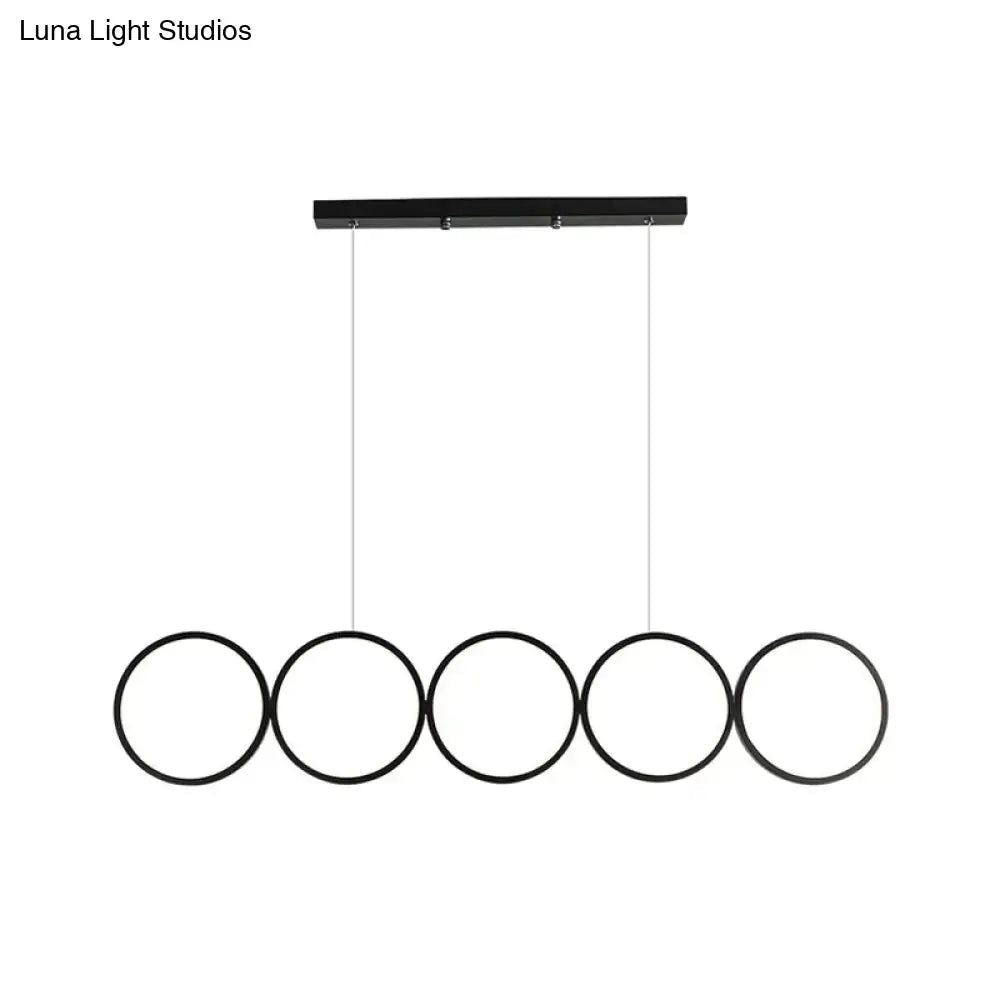 Black minimalist metallic led suspension lamp with five circular rings and warm white light for modern interiors