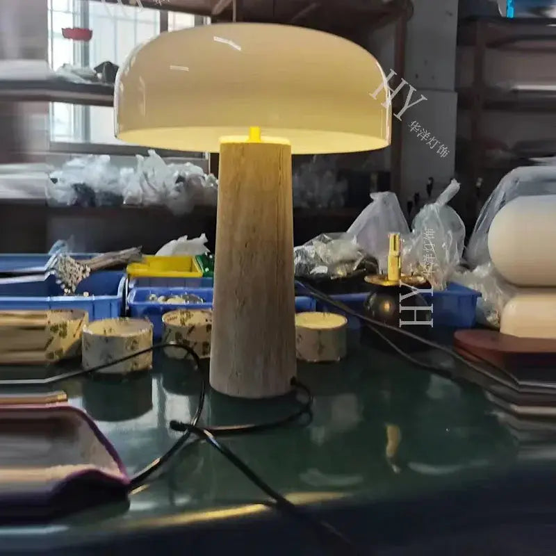 Cream-colored minimalist mushroom cave stone table lamp with frosted glass and textured wooden base for bedroom decorbites cave stone table