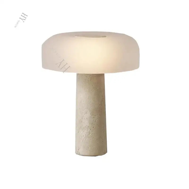 Cream-colored minimalist mushroom cave stone table lamp with textured base and frosted glass for bedroom decorbites cave stone table