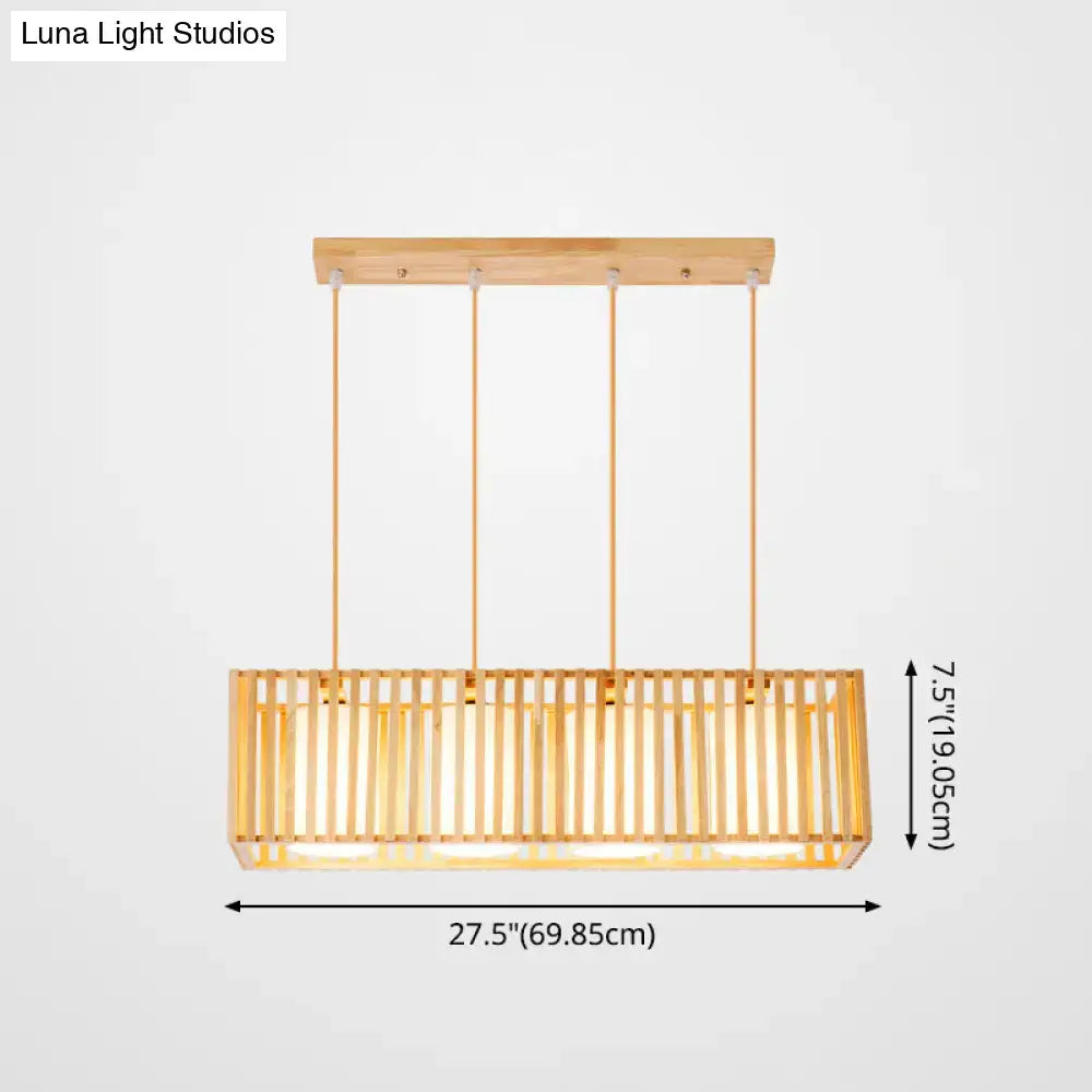 A modern rectangular pendant light with natural wood frame and vertical slats for island pendant lighting