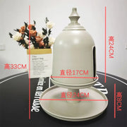 A minimalist off white ceramic birdhouse with domed top and side entrance for decorbites creative paper storage solution