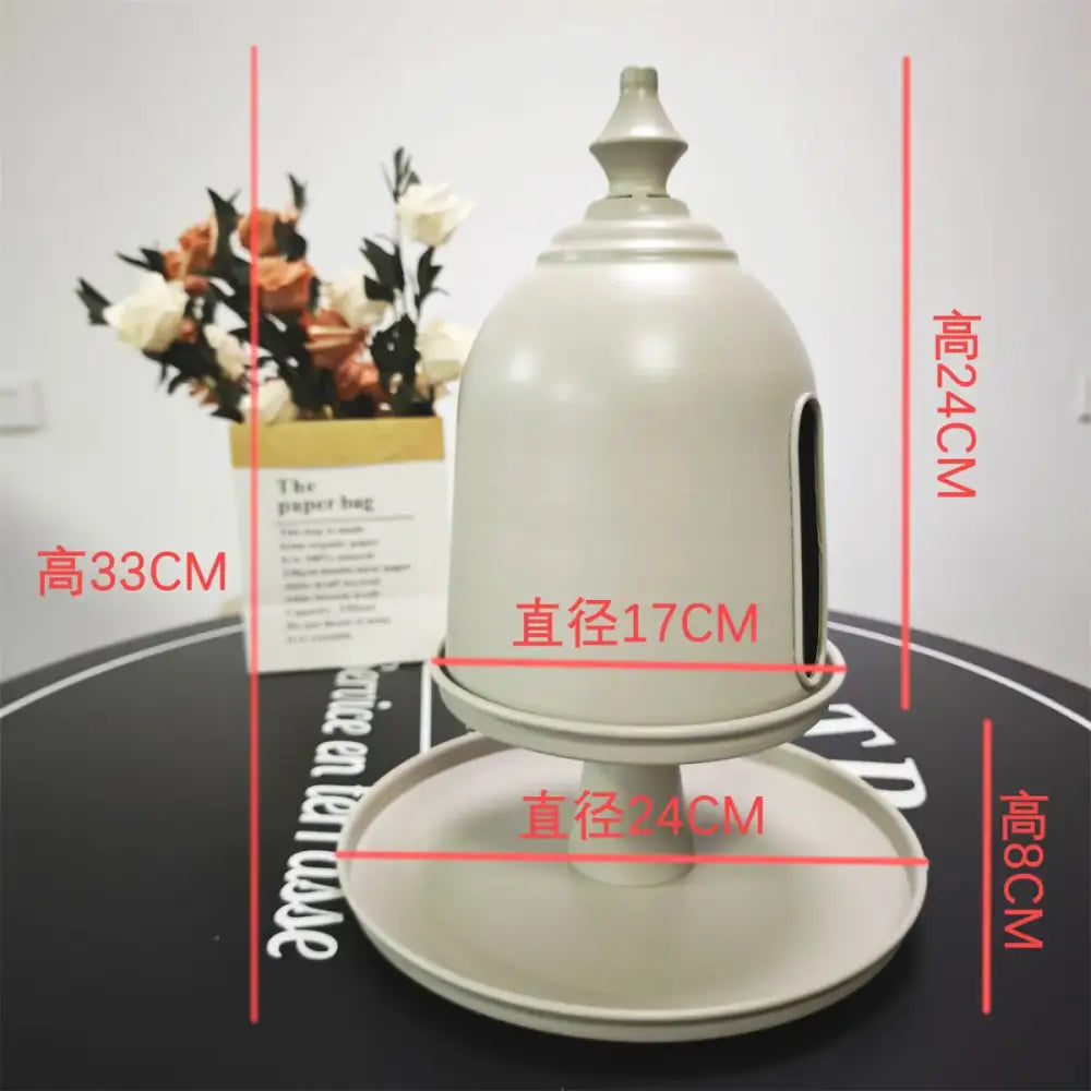 Minimalist off white ceramic bird feeder with domed top and side opening as a storage solution by decorbites creative paper