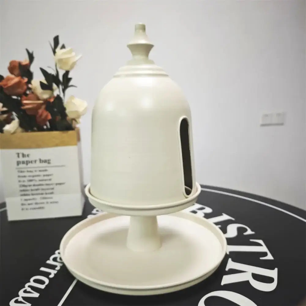 Minimalist cream-colored plastic bell-shaped paper box with narrow slot and pedestal base storage solution by decorbites creative paper