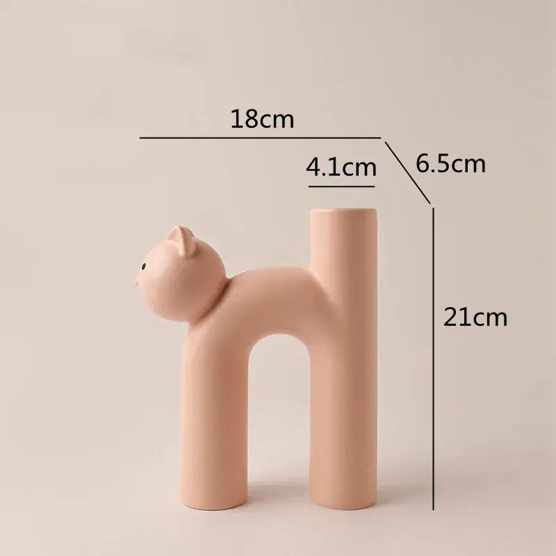 Pastel pink ceramic decorbites cathead tube vase with sleek minimalist design and smooth matte finish for living room decor