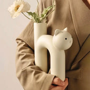 Minimalist off-white ceramic decorbites cathead h-shaped tube vase with black eyes and nose for living room decor