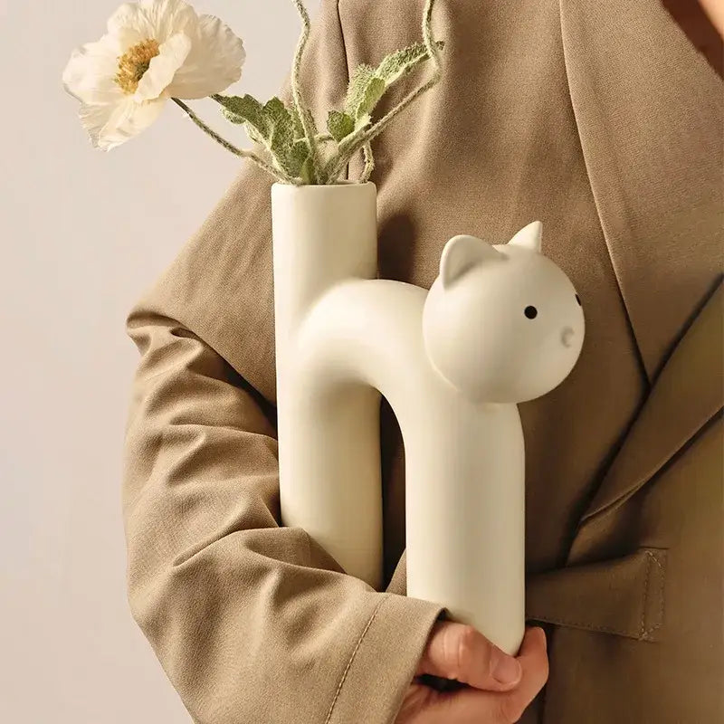 Minimalist off-white ceramic decorbites cathead h-shaped tube vase with black eyes and nose for living room decor