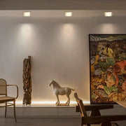 Minimalist off white ceramic horse figurine with smooth finish displayed under decorbites crystal dimmable spot light