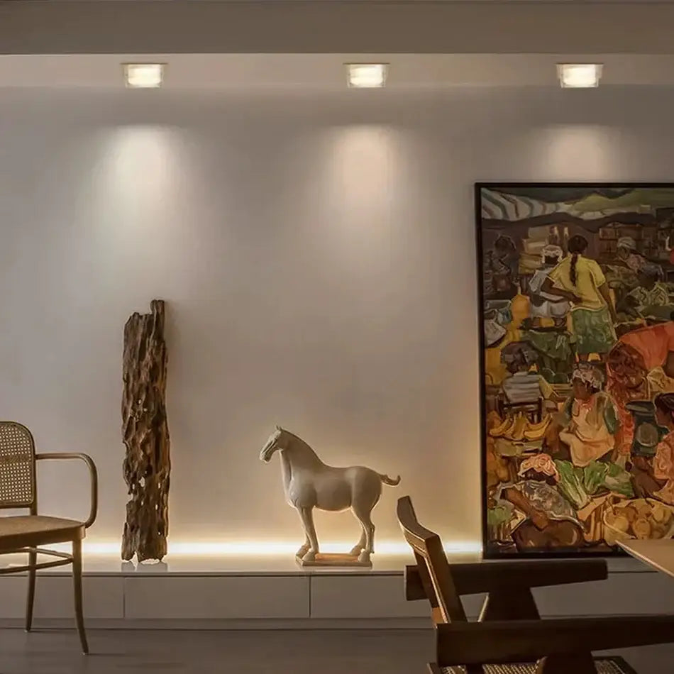 Minimalist off white ceramic horse figurine with smooth finish displayed under decorbites crystal dimmable spot light