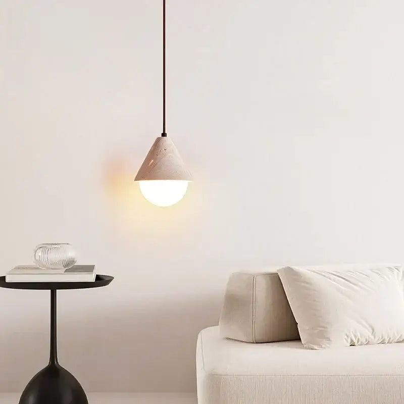 Minimalist off white pendant light with textured matte beige concrete cone shade and warm glow from decorbites creative stone led bulb