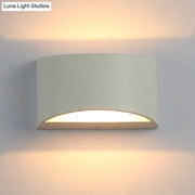 Minimalist off-white led wall light with curved metal sconce design providing warm ambient lighting for bedroom