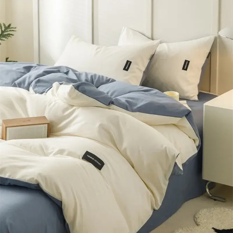 Cream and blue two-tone quilted duvet bedding set with black labels in minimalist off-white and mint matching cotton bedding set