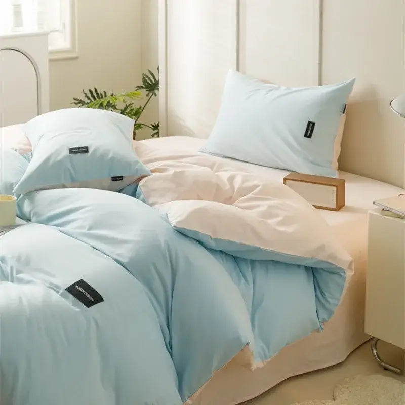 Light blue and cream two-tone quilted duvet set in minimalist off-white and mint matching cotton bedding set