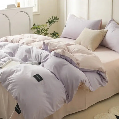 Soft lavender-colored duvet cover with subtle sheen and stitched edges in minimalist off-white and mint matching cotton bedding set