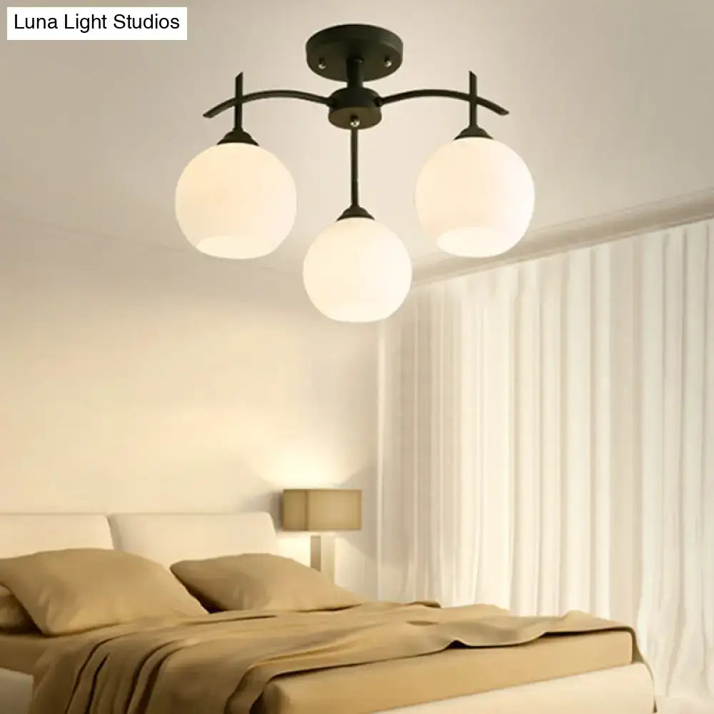 Black metal chandelier with three frosted opal glass globe shades ceiling light for living room by DecorBites