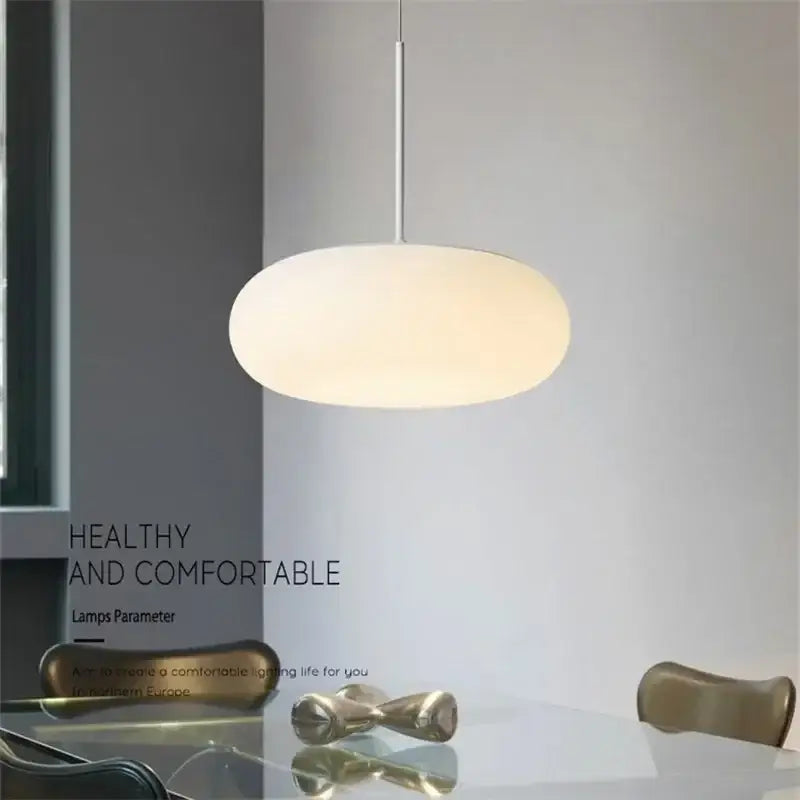 Minimalist oval white frosted glass pendant lamp with metallic rod from decorbites big ball pendant collection for living room