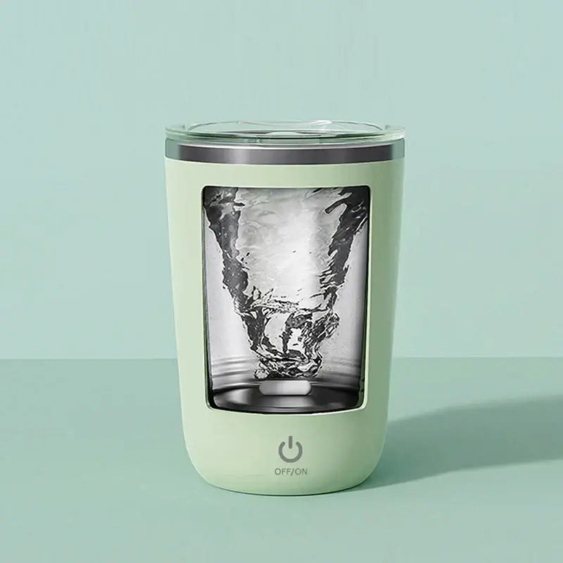 Mint green insulated coffee cup with clear glass interior and silver rim featuring electric magnetic stirring display