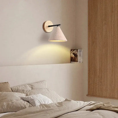 Minimalist pink concrete wall sconce with circular wooden backplate black metal arm and beige shade for bedroom decorbites iron yellow