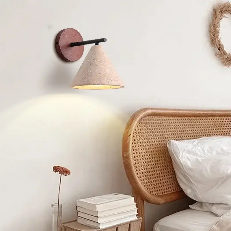 Beige cone-shaped wall sconce with matte terracotta base and black arm for minimalist bedroom decorbites iron yellow style