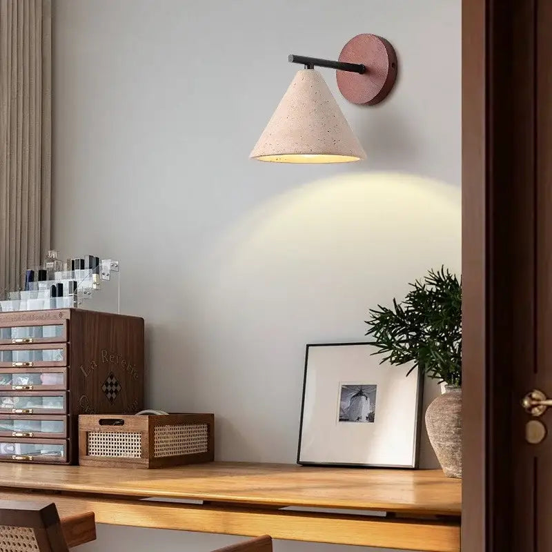 Minimalist pink concrete wall sconce with matte pink backplate and black arm for bedroom decorbites iron yellow style