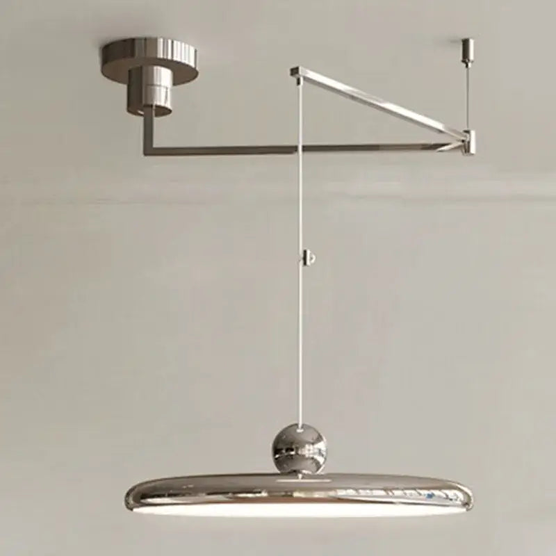Minimalist pendant light with chrome finish cream iron art shade and spherical accent for bedroom decorbites cream iron