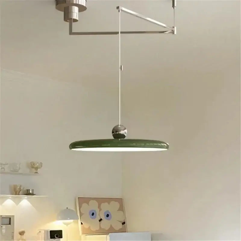 Modern green circular pendant light with sleek metallic suspension and spherical accent for decorbites cream iron art decor