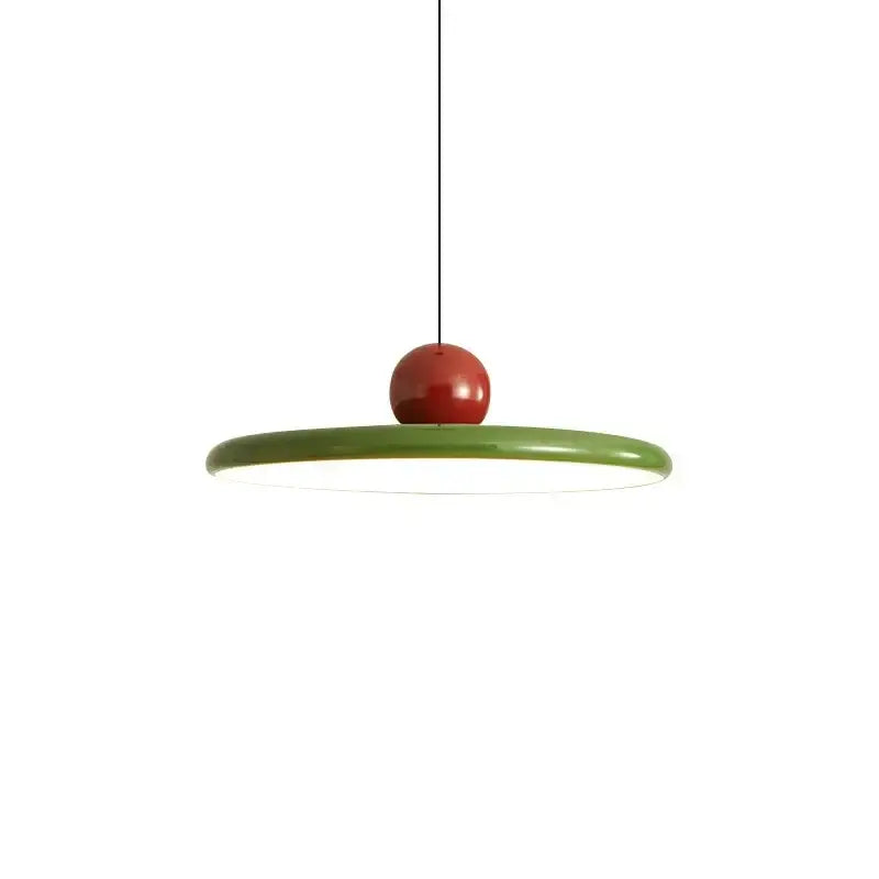 Minimalist cord pendant light with a glossy green acrylic base and polished red spherical top for dining room use