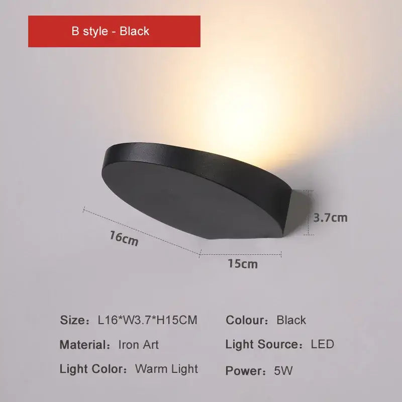Minimalist silver and black led wall lamp with sleek modern design and warm illumination for bedroom use