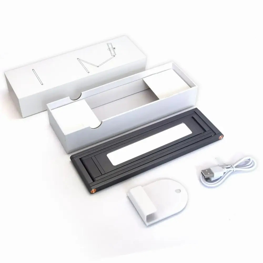 Minimalist black rectangular foldable dimmable led desk lamp with gold accents and white usb charging cable decorbites dimmable led