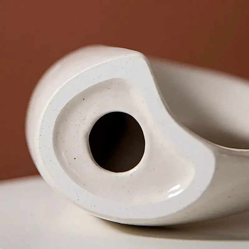 White ceramic donut candle holder with smooth glossy finish and subtle speckles for minimalist dining room decorbites ceramic donut
