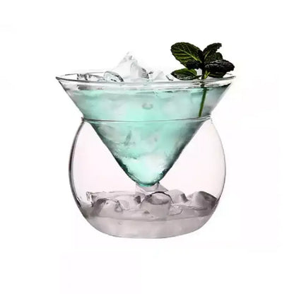 Minimalist clear glass 150ml stemless martini chiller filled with ice and a light blue drink garnished with fresh mint